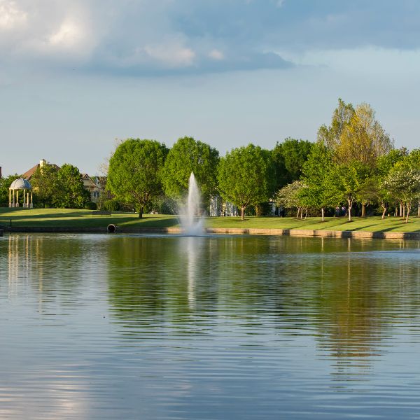 Community fountain in a neighborhood pond