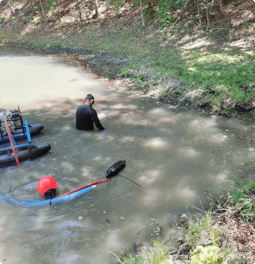 AWW cleaning inside of a pond