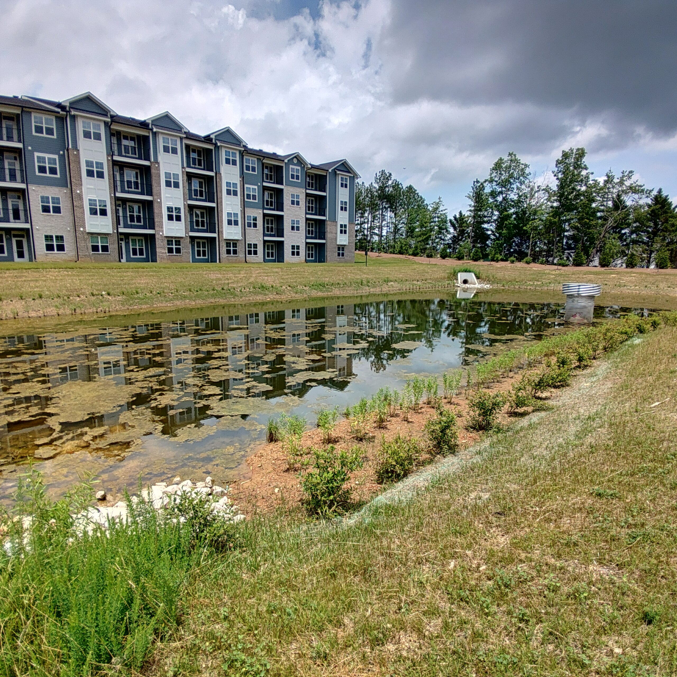 Stormwater detention pond near apartment complex